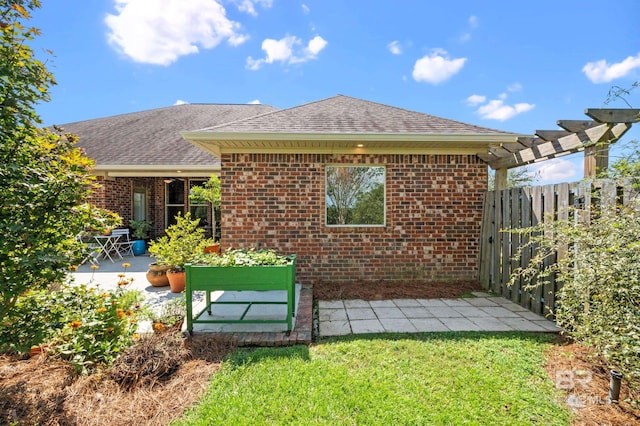 back of property featuring a patio area