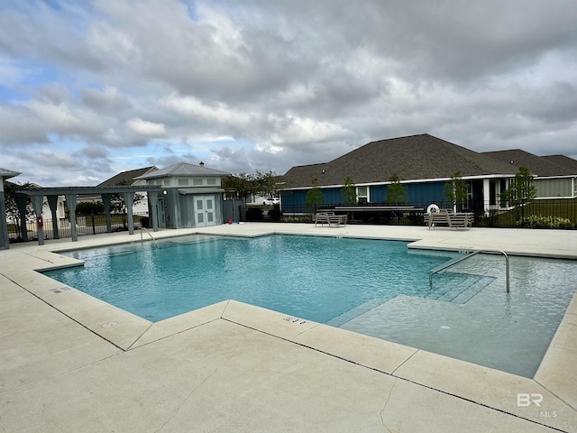 1040 Hayward Loop, Foley, AL 36535 - community pool featuring a patio area and a pergola