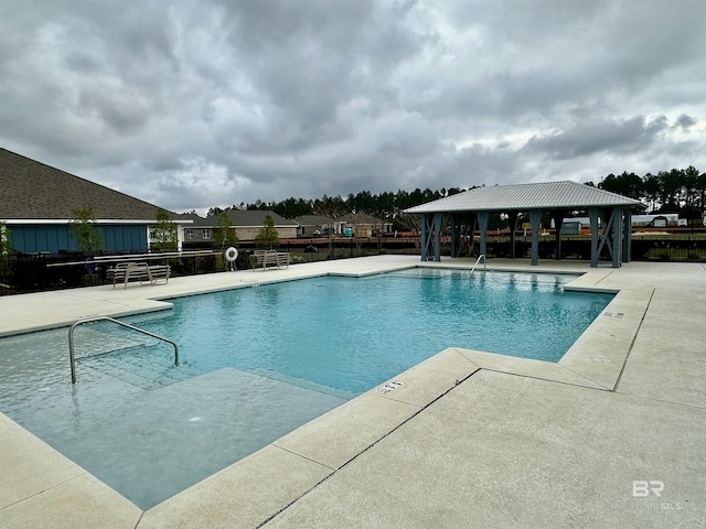 1040 Hayward Loop, Foley, AL 36535 - community pool featuring a gazebo and a patio area