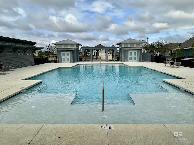1040 Hayward Loop, Foley, AL 36535 - community pool with an outbuilding and a patio