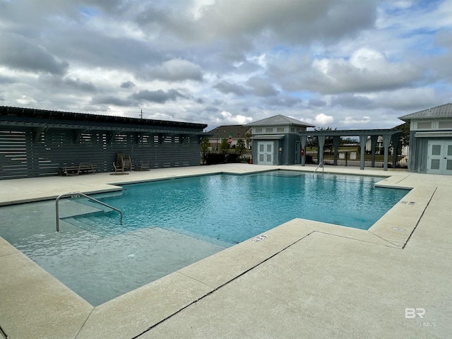 1040 Hayward Loop, Foley, AL 36535 - community pool with a pergola, a patio, and french doors
