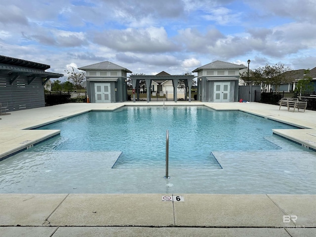 1040 Hayward Loop, Foley, AL 36535 - community pool with french doors, a patio, and an outdoor structure