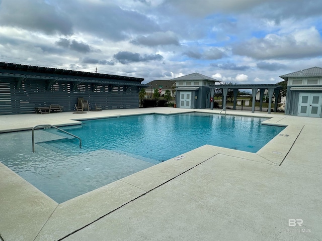 1040 Hayward Loop, Foley, AL 36535 - community pool with a patio area, an outbuilding, a pergola, and a storage structure