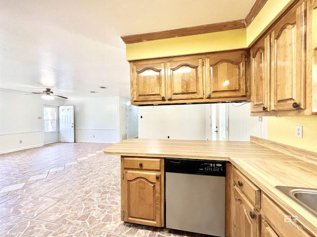 kitchen with light countertops, a ceiling fan, stone finish floor, a peninsula, and stainless steel dishwasher