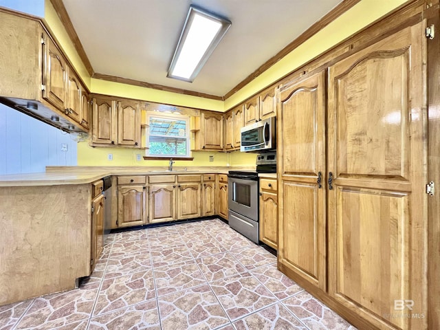 kitchen with a sink, light countertops, appliances with stainless steel finishes, crown molding, and stone finish flooring