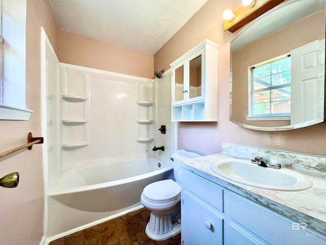 full bathroom with tile patterned floors, shower / bath combination, vanity, and toilet