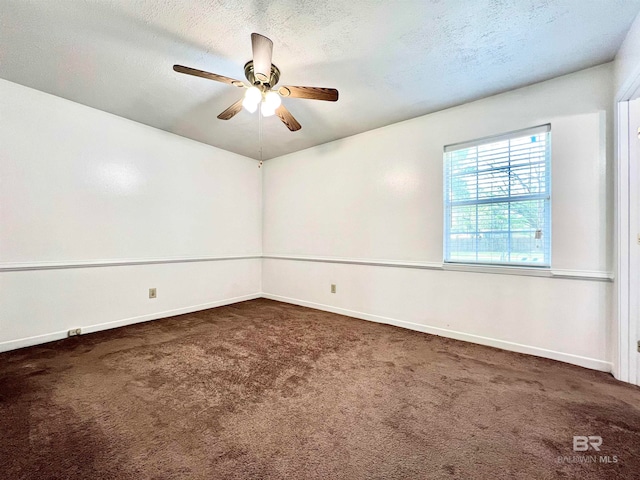 carpeted empty room with a textured ceiling and ceiling fan