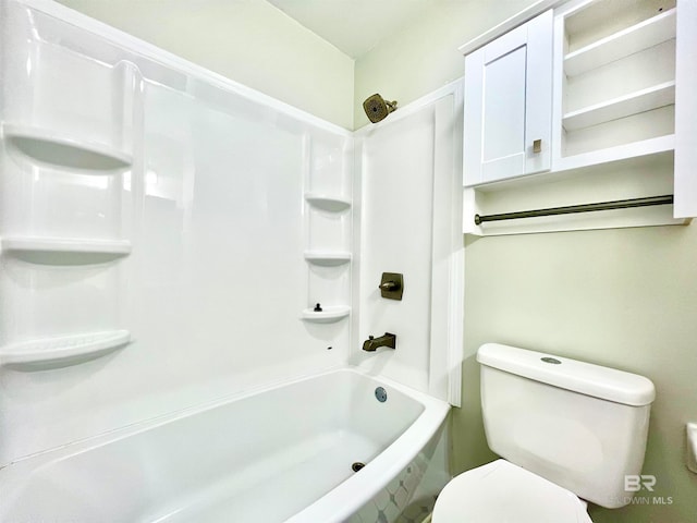 bathroom with toilet and bathtub / shower combination