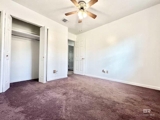 unfurnished bedroom featuring a closet, baseboards, carpet flooring, visible vents, and ceiling fan