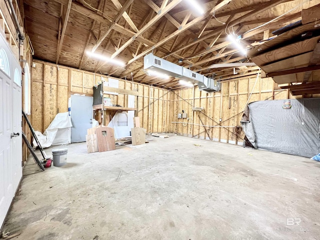 misc room featuring visible vents and a garage