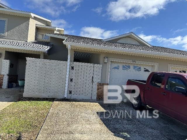 view of side of home featuring a garage