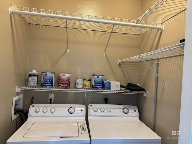 clothes washing area with independent washer and dryer