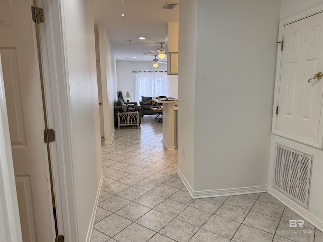 hall with light tile patterned flooring