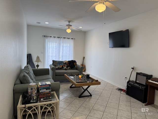 living room with ceiling fan and light tile patterned floors