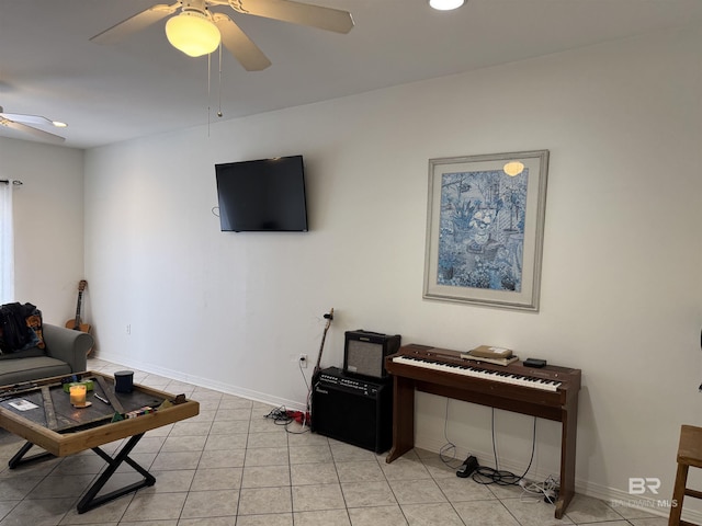 tiled living room with ceiling fan