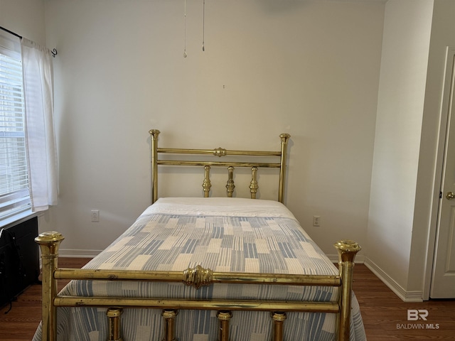 bedroom featuring dark hardwood / wood-style floors