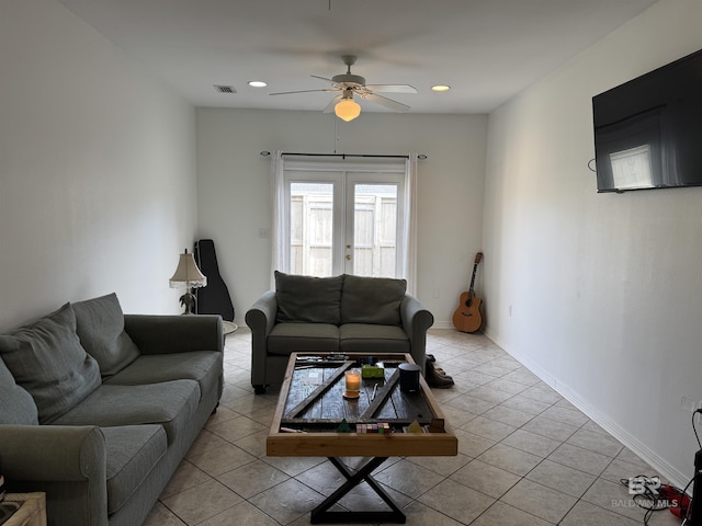 living room featuring ceiling fan, french doors, and light tile patterned flooring