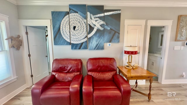 living room with crown molding and hardwood / wood-style floors