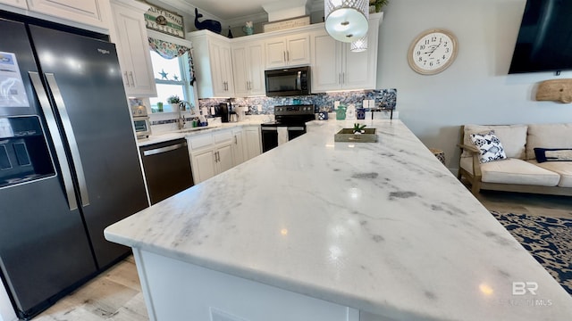 kitchen with crown molding, backsplash, stainless steel appliances, light stone countertops, and sink