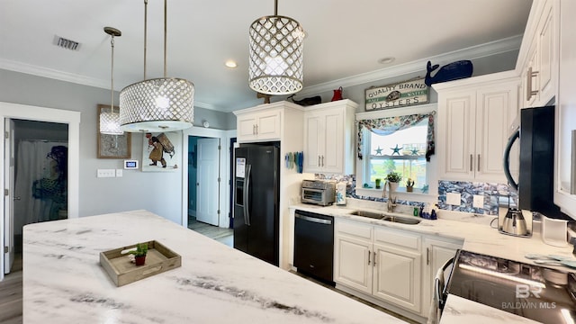 kitchen with sink, crown molding, black appliances, white cabinets, and decorative light fixtures