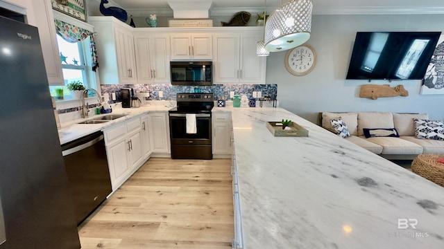 kitchen with electric stove, sink, dishwashing machine, backsplash, and light stone countertops