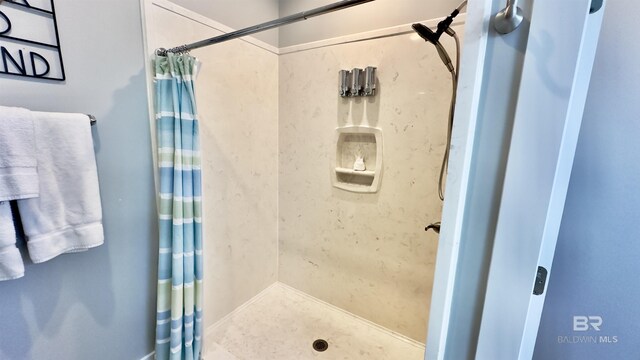 bathroom with a shower with curtain