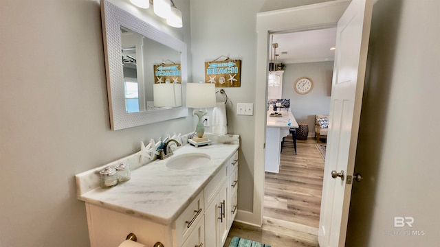 bathroom featuring vanity and hardwood / wood-style floors