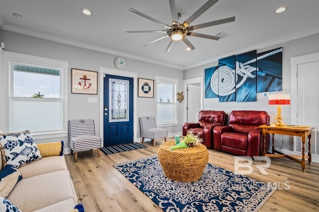 living room with ornamental molding, hardwood / wood-style flooring, and a wealth of natural light