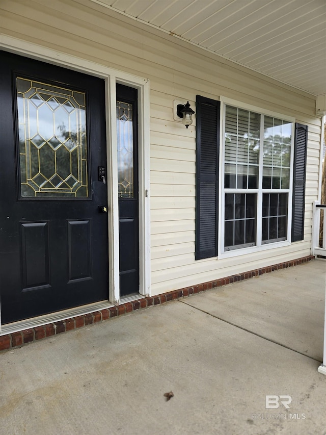 entrance to property with a porch