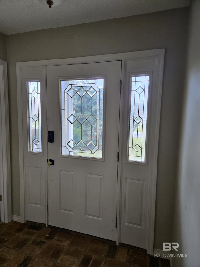 foyer entrance with brick floor