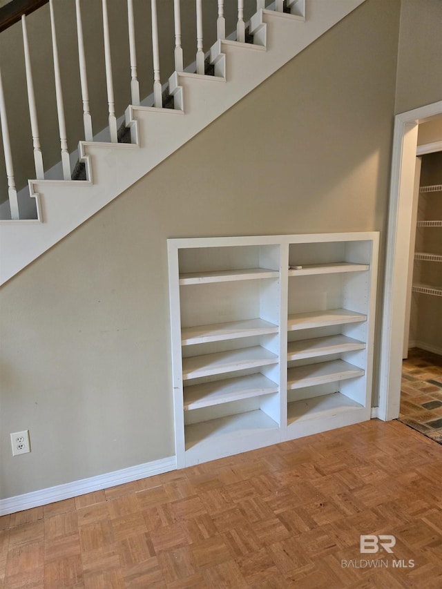 interior space featuring baseboards