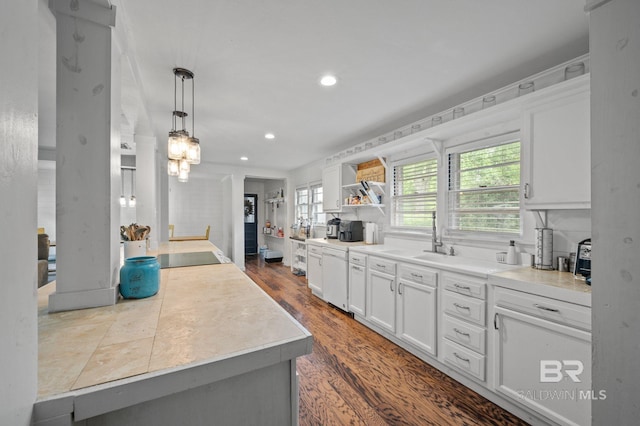 kitchen with recessed lighting, white cabinetry, light countertops, black electric stovetop, and open shelves