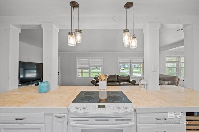 kitchen featuring white range with electric stovetop, open floor plan, white cabinetry, and light countertops