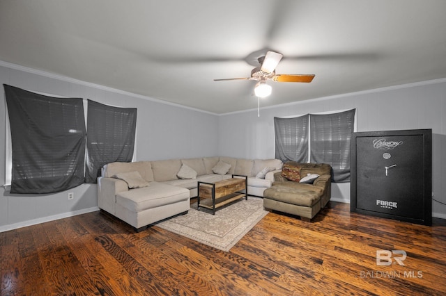 living area with wood finished floors, crown molding, and ceiling fan