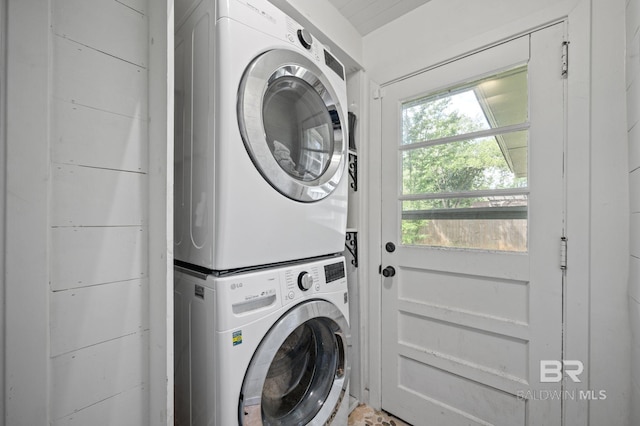 laundry room with estacked washer and dryer
