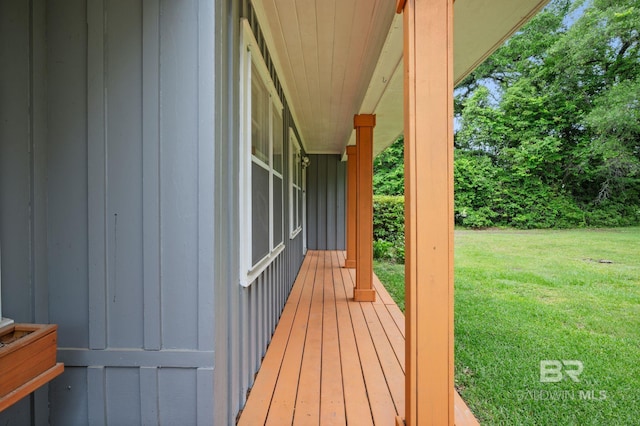 wooden deck with a yard