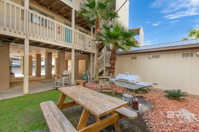 930 W Beach Blvd Unit 108, Gulf Shores, AL 36542 - view of patio with stairs and a grill