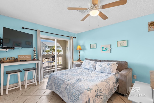 930 W Beach Blvd Unit 108, Gulf Shores, AL 36542 - tiled bedroom with access to exterior, a textured ceiling, and a ceiling fan