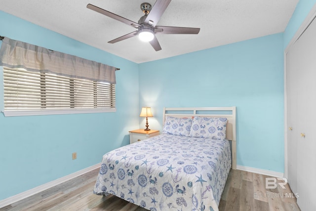 930 W Beach Blvd Unit 108, Gulf Shores, AL 36542 - bedroom featuring wood finished floors, baseboards, ceiling fan, and a closet