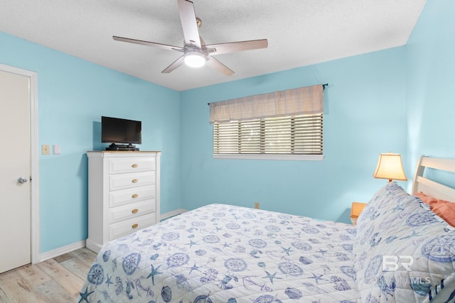 930 W Beach Blvd Unit 108, Gulf Shores, AL 36542 - bedroom featuring light wood-style flooring, a ceiling fan, and baseboards
