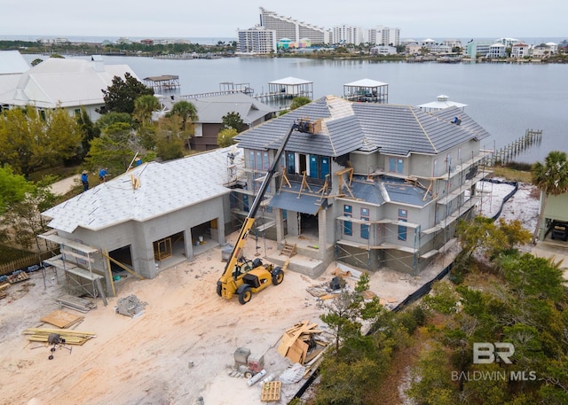 birds eye view of property with a water view