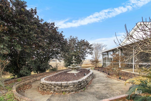 view of yard featuring a sunroom