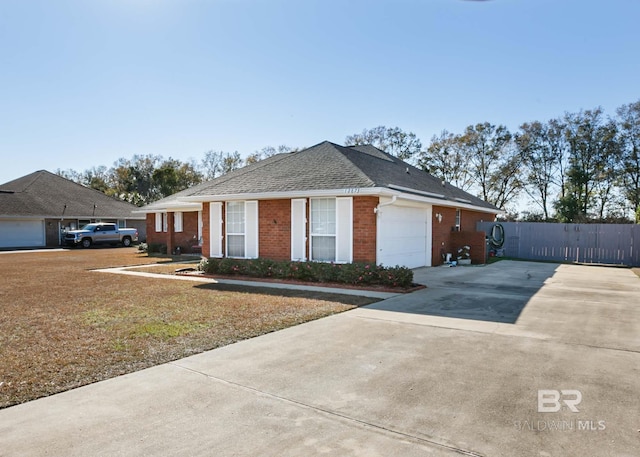 view of home's exterior featuring a garage, brick siding, a shingled roof, fence, and concrete driveway