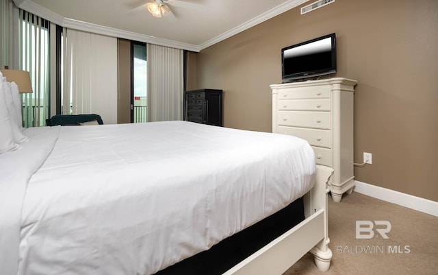 bedroom with carpet flooring, ceiling fan, and ornamental molding