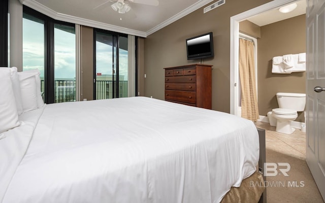 bedroom featuring access to exterior, ensuite bath, ceiling fan, and crown molding