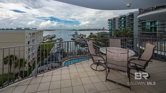 balcony featuring a water view