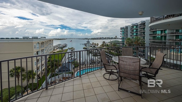 balcony featuring a water view