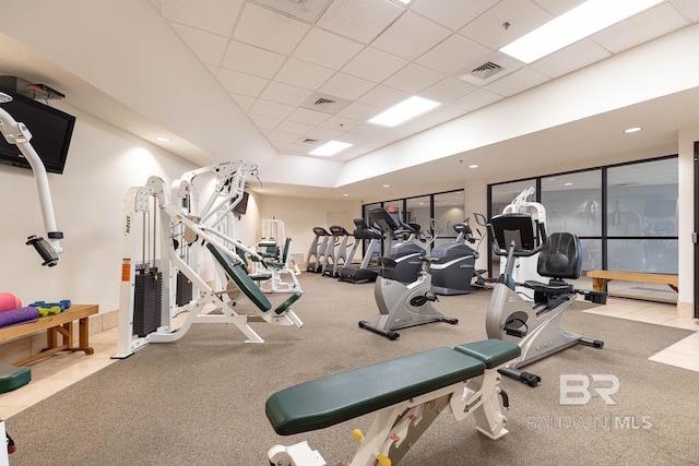 gym featuring a paneled ceiling