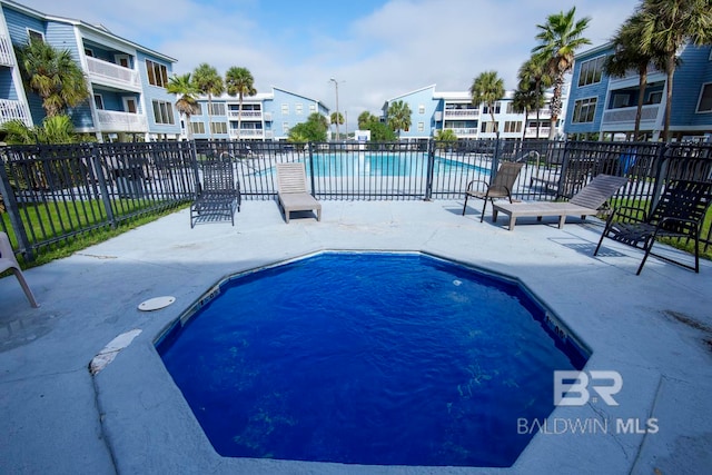 view of pool featuring a patio area