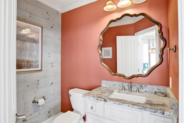 825 W Beach Blvd Unit 10, Gulf Shores, AL 36542 - half bath featuring wooden walls, toilet, and vanity